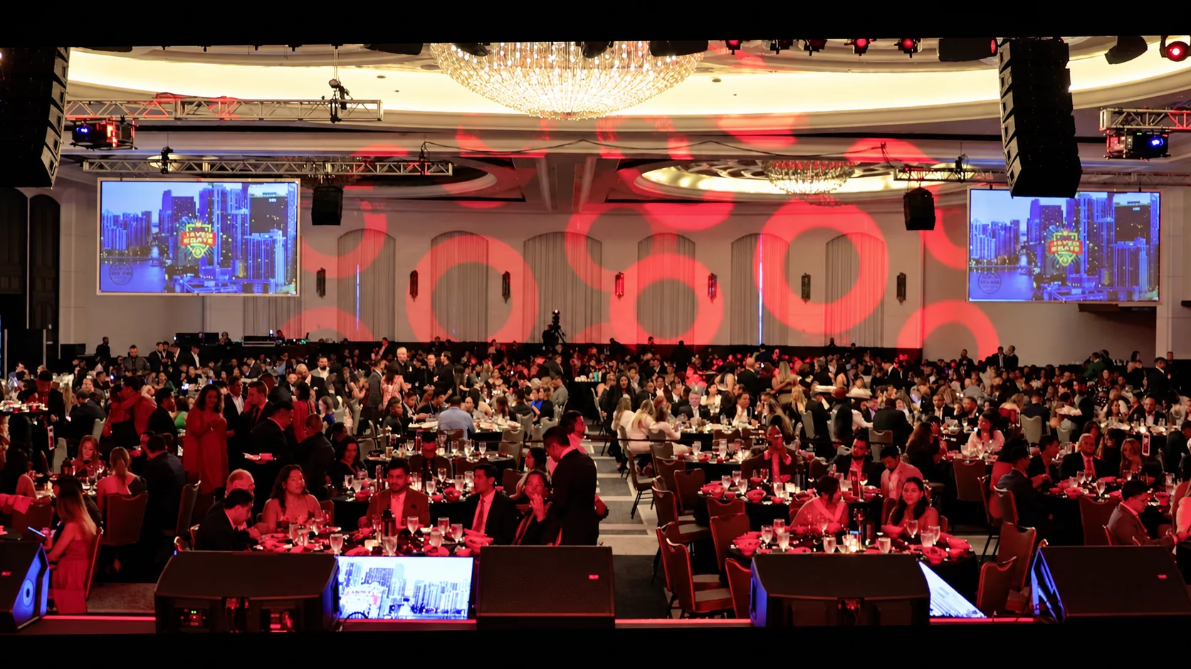 Gala dinner with red lighting in a ballroom